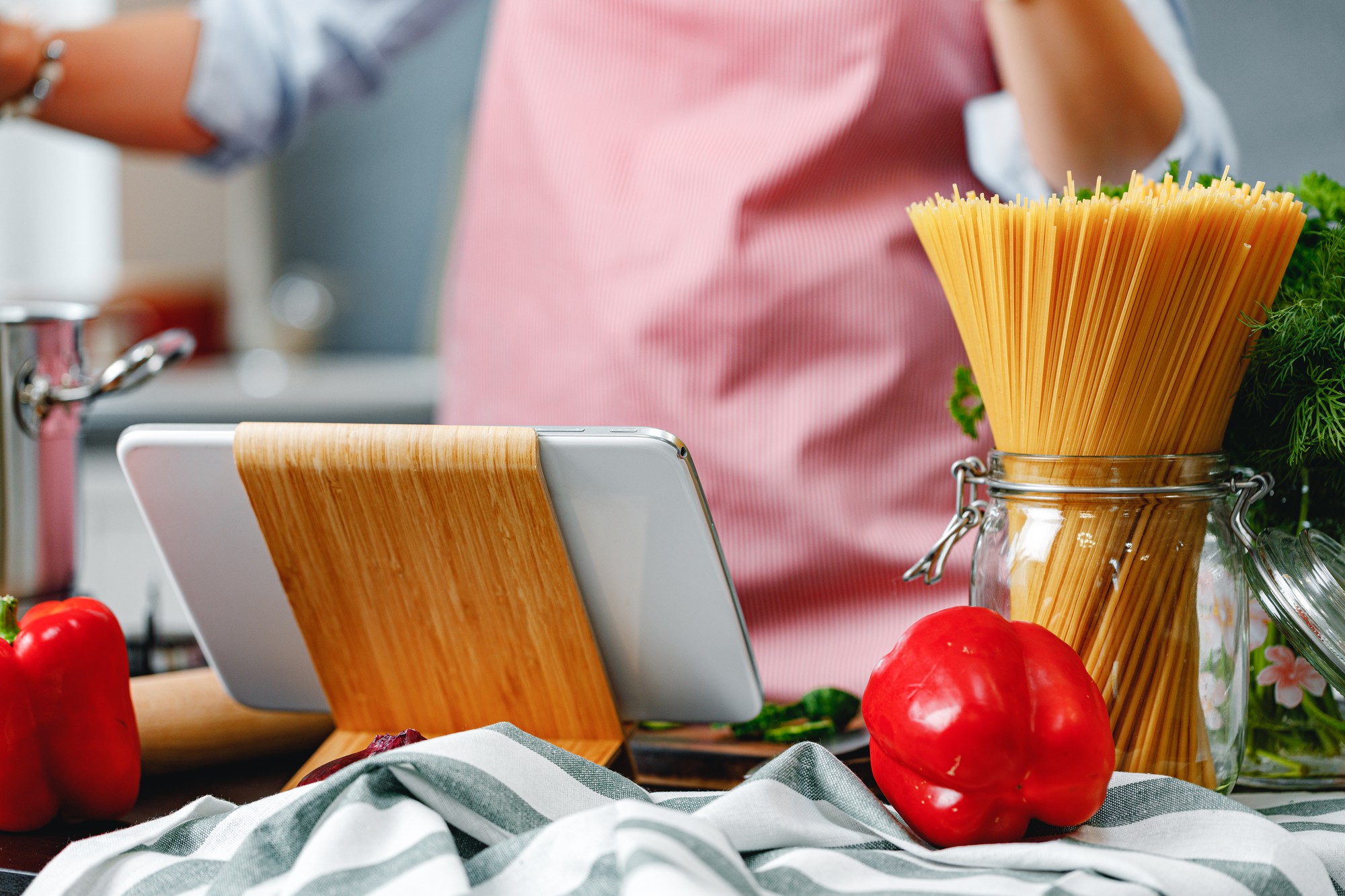 Home kitchen workspace with ingredients and laptop