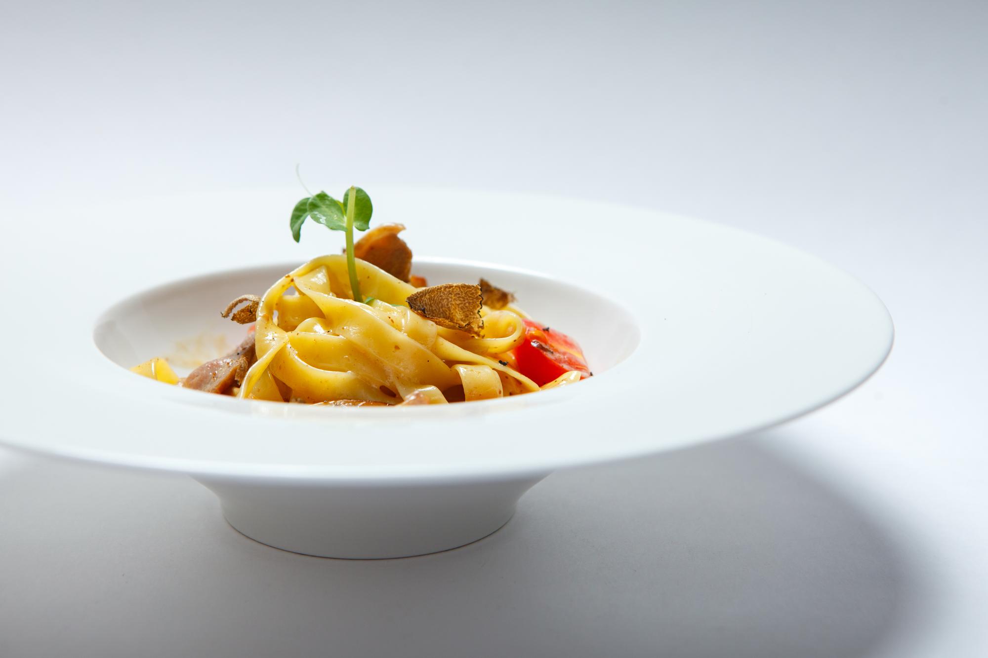 Plated modern pasta dish from online class