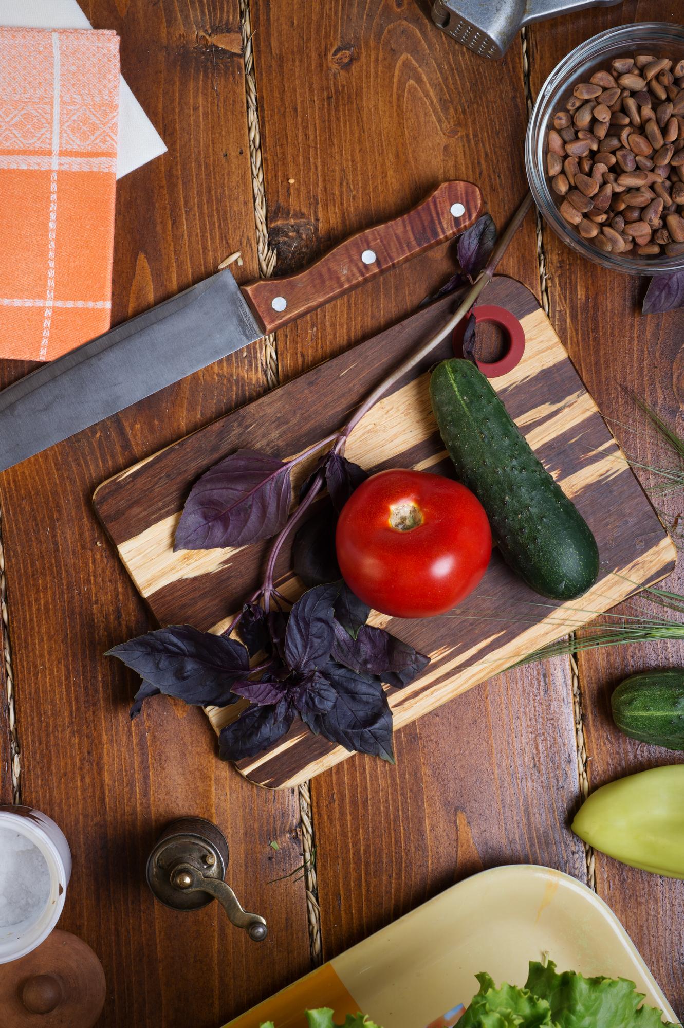 Neat mise en place with fresh produce and utensils